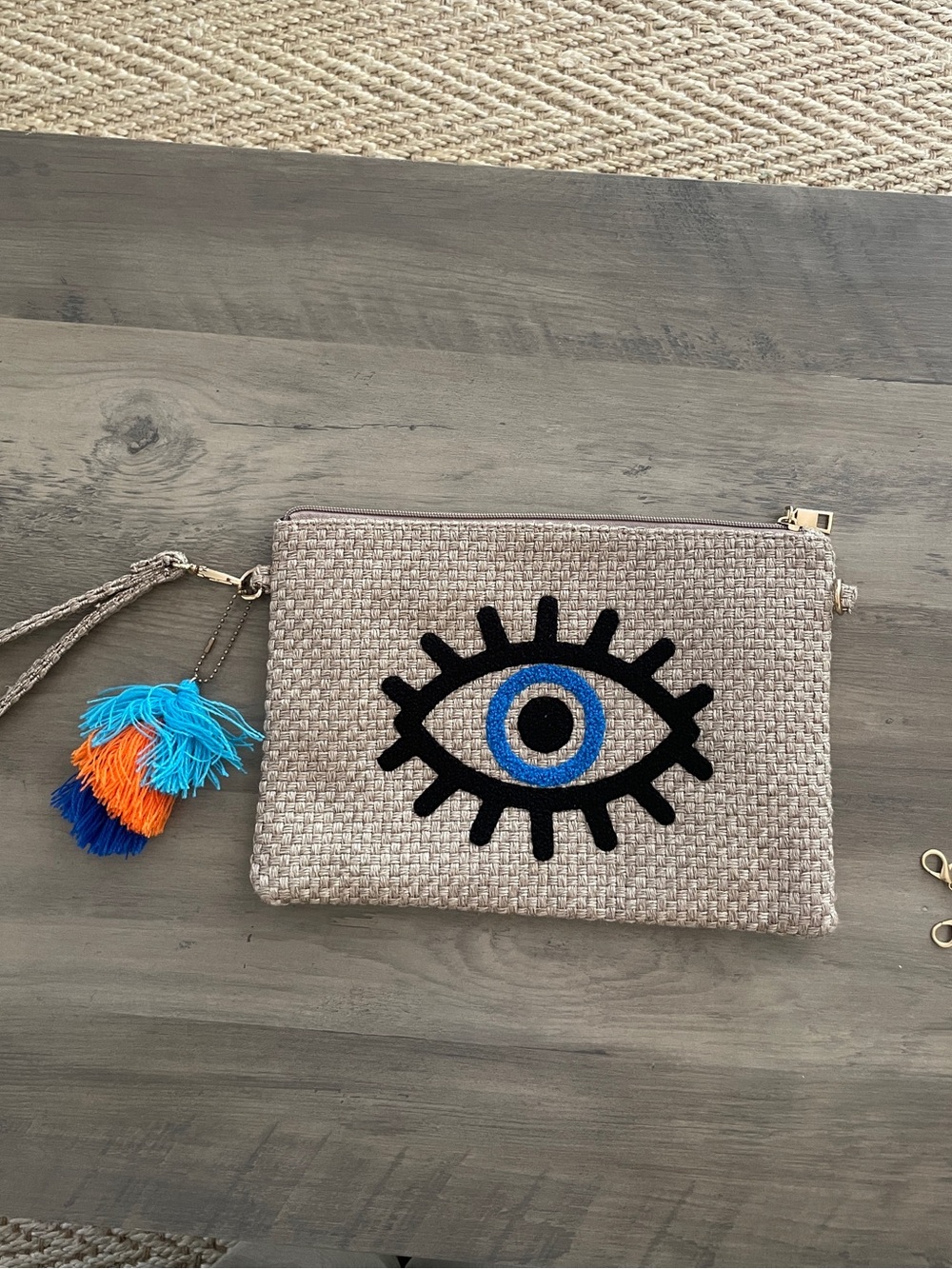 Woven Eye Wristlet Clutch in Beige with Blue Accent